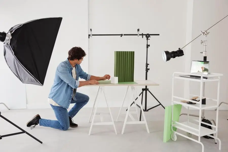 Photographer managing bookings and clients in studio