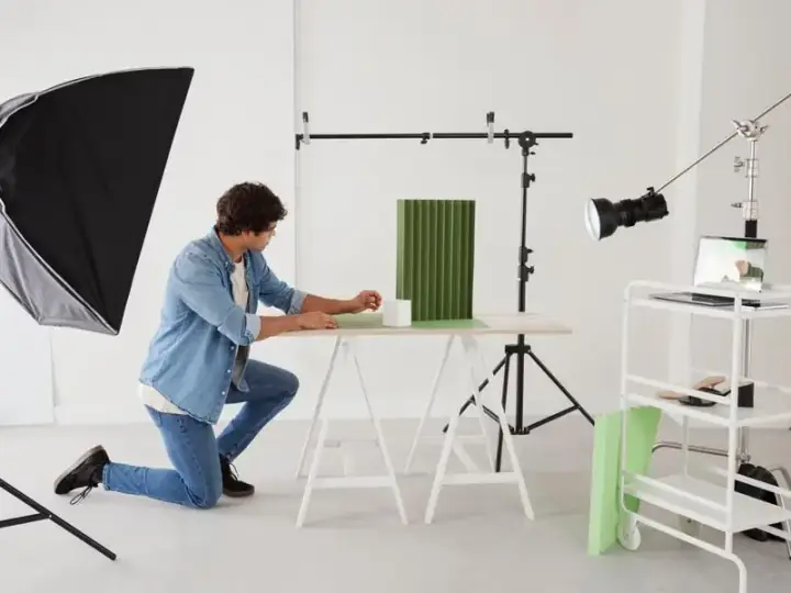 Photographer managing bookings and clients in studio