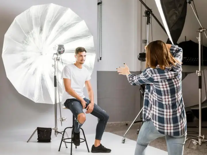 Photographer managing a client photo session