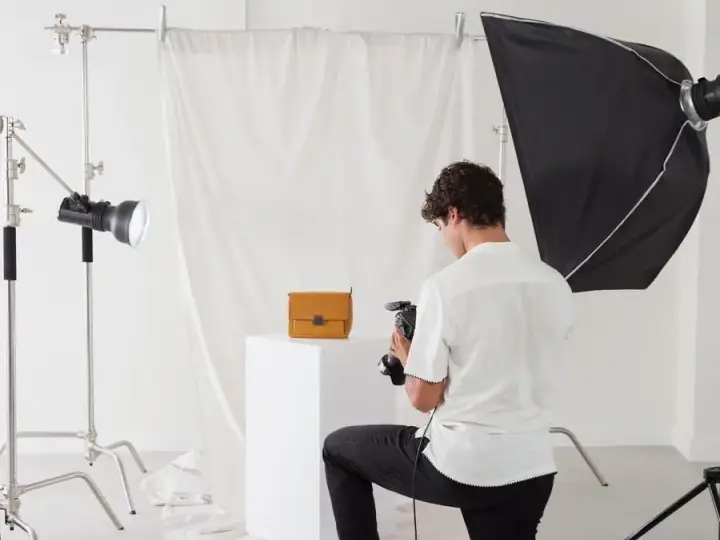 Young photographer working in his photography studio