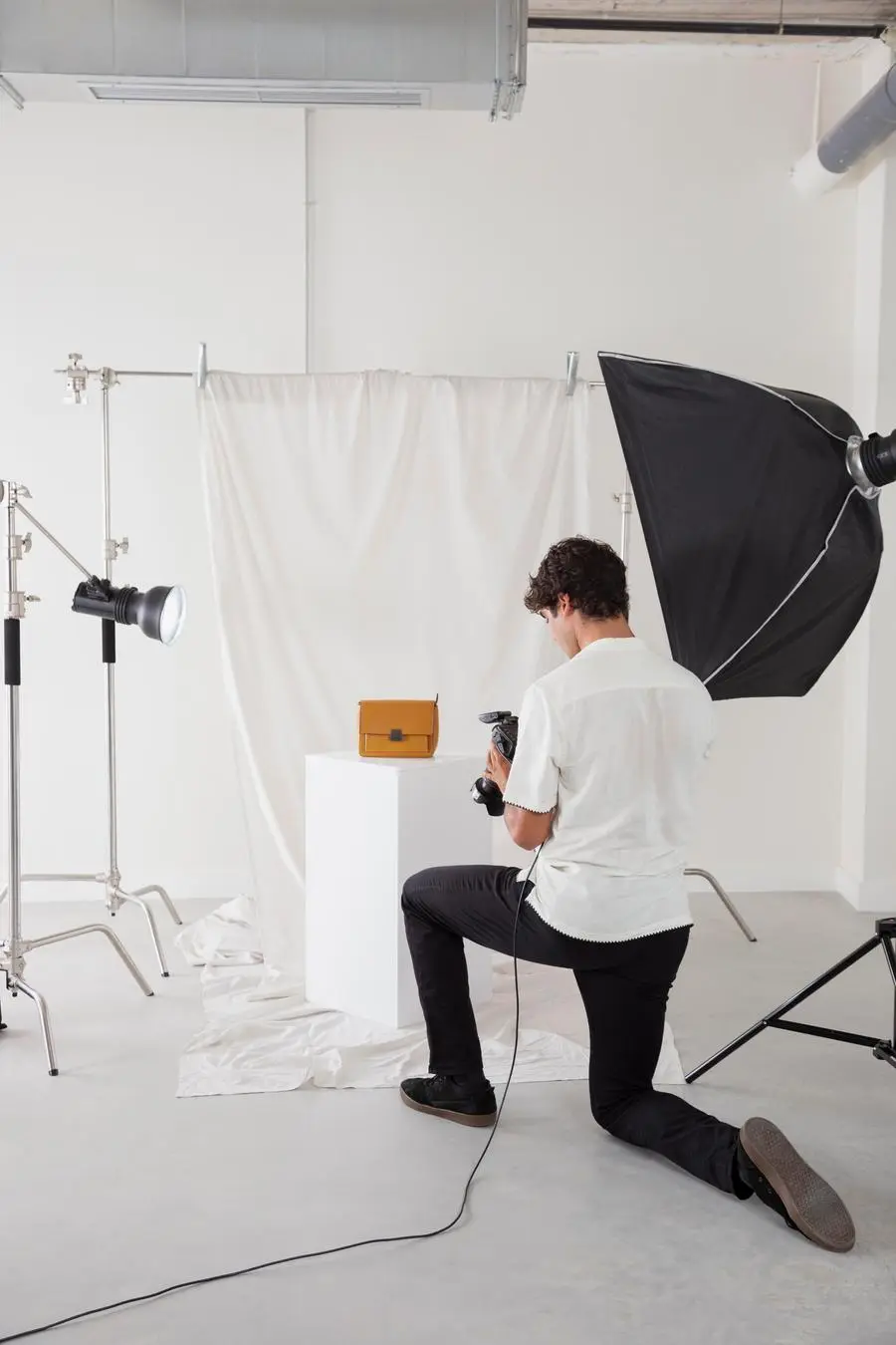 Young photographer working in his photography studio